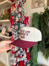Load image into Gallery viewer, Put it on Santa&#39;s Tab Trucker Hat
